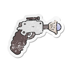 distressed sticker of a cartoon ray gun