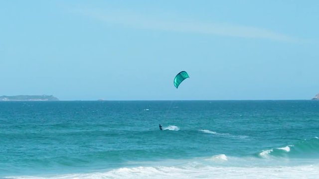 Man kite surfing in Florianpolis, Brazil.