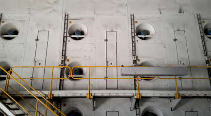 Walk way with yellow handrail in side of Paper machine