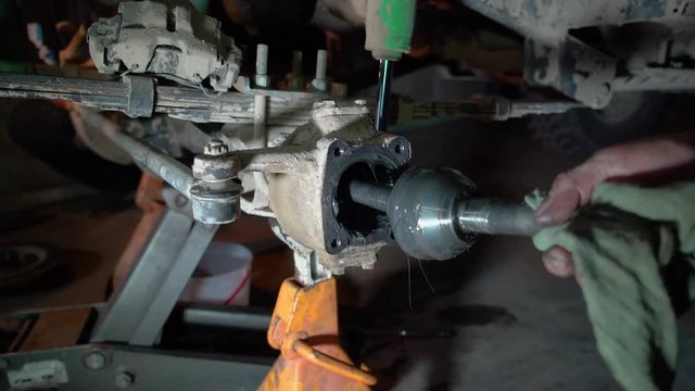 Removing axles from axle housing
