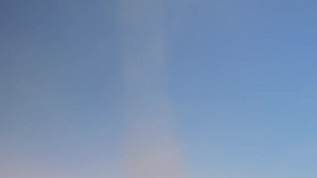 A tilt shot of a dust devil in the desert of Morocco, in slow motion.