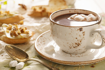 Hot chocolate with marshmallow and bruschetta or crostini.