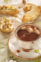 Hot chocolate with marshmallow and bruschetta or crostini.