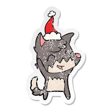 happy distressed sticker cartoon of a fox wearing santa hat