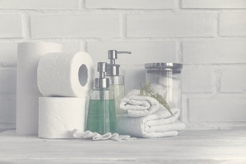 Foggy part of spa interior. Cotton napkins, cotton pads, tissue, towels, soap and cosmetic products...