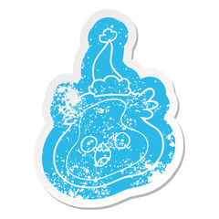 cartoon distressed sticker of a germ wearing santa hat