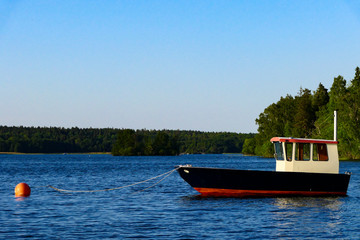 Fototapeta premium Stockholm, Sweden The crisp lines of a little boat in Lake Malaren.