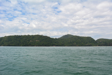 Summer landscape with sea and mountain range with sky, Beautiful tropical Thailand island.