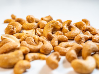 Roasted cashew nut close up on white background