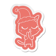 calm cartoon  sticker of a cat wearing santa hat
