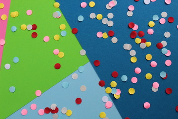 Bright multi colored circles lie on a multicolored background