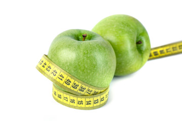 green apples with Measuring tape on white background