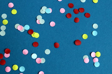 Texture bright multicolor confetti on blue background