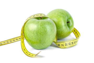 green apples with Measuring tape on white background