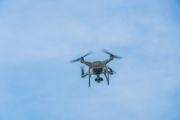 flying drone with blue sky background