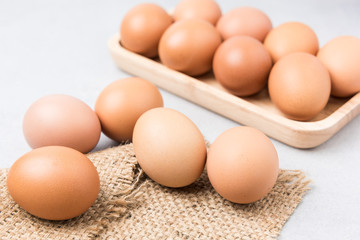 Fresh Eggs (chicken) Close-up with stone white background.