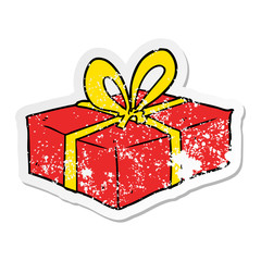 distressed sticker of a cartoon wrapped gift