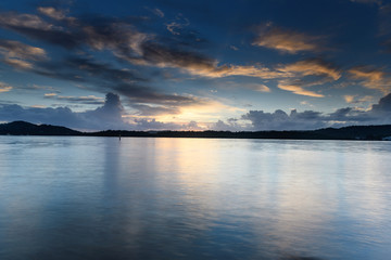 Naklejka premium Early Morning Clouds and Reflections on the Bay