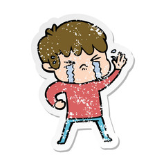 distressed sticker of a cartoon boy crying