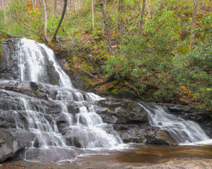 A waterfall in the great Smokey Mountains cascades down a natural rock wall worn by erosion