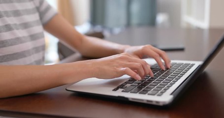 Woman type on her laptop computer