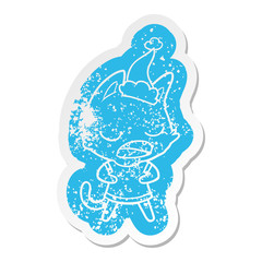 talking cat cartoon distressed sticker of a wearing santa hat