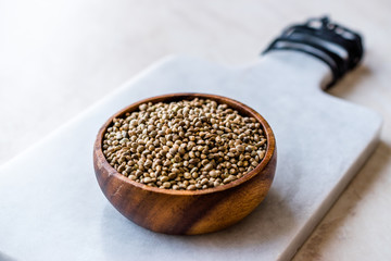 Organic Roasted Hemp Seeds in Wooden Bowl.
