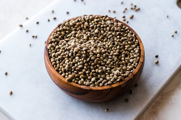Organic Roasted Hemp Seeds in Wooden Bowl.