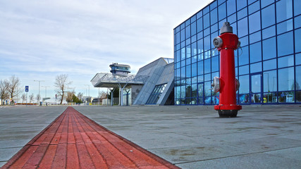 red fire hydrant outside the building