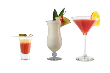 A variety of alcoholic drinks, beverages and cocktails on a white background. Three drinks with original decoration.