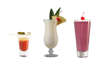 A variety of alcoholic drinks, beverages and cocktails on a white background. Three drinks with decoration.