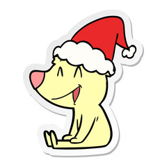 sitting bear sticker cartoon of a wearing santa hat