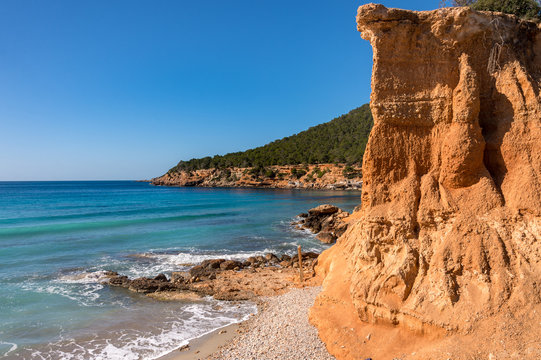 "Es Bol Nou" is one of the natural beaches of the island of Ibiza. Surrounded by limestone cliffs that give it an orange color. It is a typical beach among the locals.
