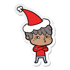 sticker cartoon of a curious man wearing santa hat