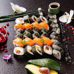 big set of sushi on the black background