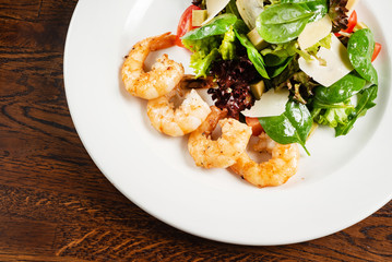 fried shrimps with salad