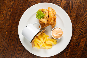 fried chicken with french fries and sauce