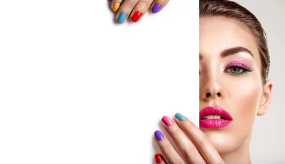 Door stickers Manicure Beautiful  woman with a colored manicure holds blank poster.