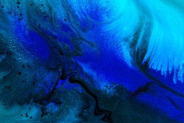 Abstract painting drawn by fluid acrylic technique. Creative design wallpaper for desktop. Picture with blue, green water stains, gradients, black spots on dark background. Modern art concept.