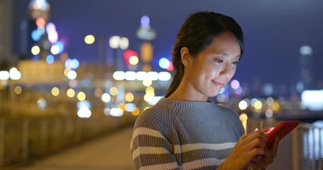 Woman use of mobile phone at outdoor