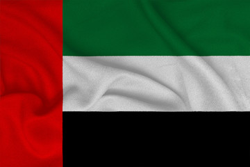 Flag of the United Arab Emirates from the factory knitted fabric. Backgrounds and Textures