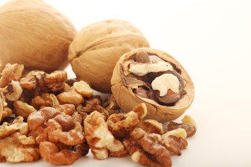 A pile of peeled walnuts at white background