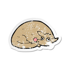 retro distressed sticker of a cartoon curled up dog