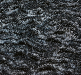Artificial black fur. Fabric, texture, background