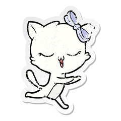 distressed sticker of a cartoon cat with bow on head