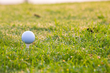 Golf ball on tee ready to be shot