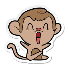 sticker of a cartoon laughing monkey
