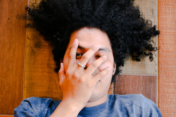 Boy looking through his fingers