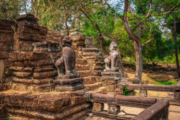 Preah Khan temple, Cabodia: Khmer style lions  at the entrance to terrce
