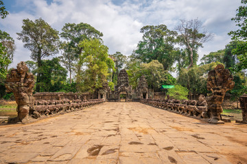 Preah Khan temple, Cabodia: Causeway with railings depicting Churning of the sea of milk of khmer mythology